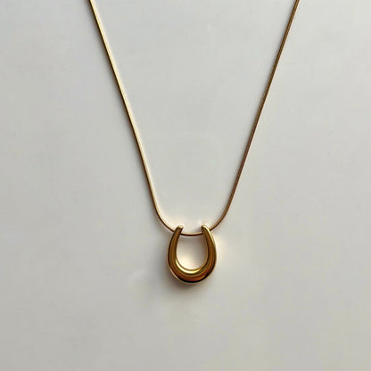 Lucky Horseshoe Gold-Plated Necklace - Symbol of Elegance and Good Fortune by Baleh Jewels. Elevate your style with this timeless accessory, meticulously crafted for lasting charm and sophistication.