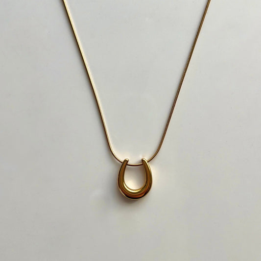 Lucky Horseshoe Gold-Plated Necklace - Symbol of Elegance and Good Fortune by Baleh Jewels. Elevate your style with this timeless accessory, meticulously crafted for lasting charm and sophistication.