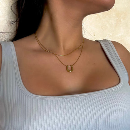 Lucky Horseshoe Gold-Plated Necklace - Symbol of Elegance and Good Fortune by Baleh Jewels. Elevate your style with this timeless accessory, meticulously crafted for lasting charm and sophistication.